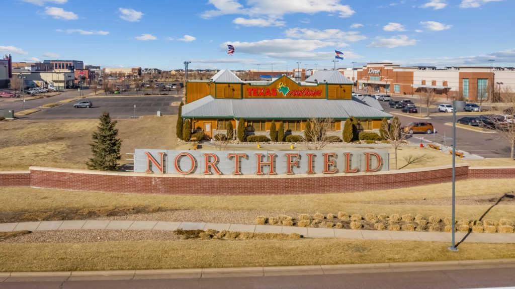 Northfield monument sign in front of store.